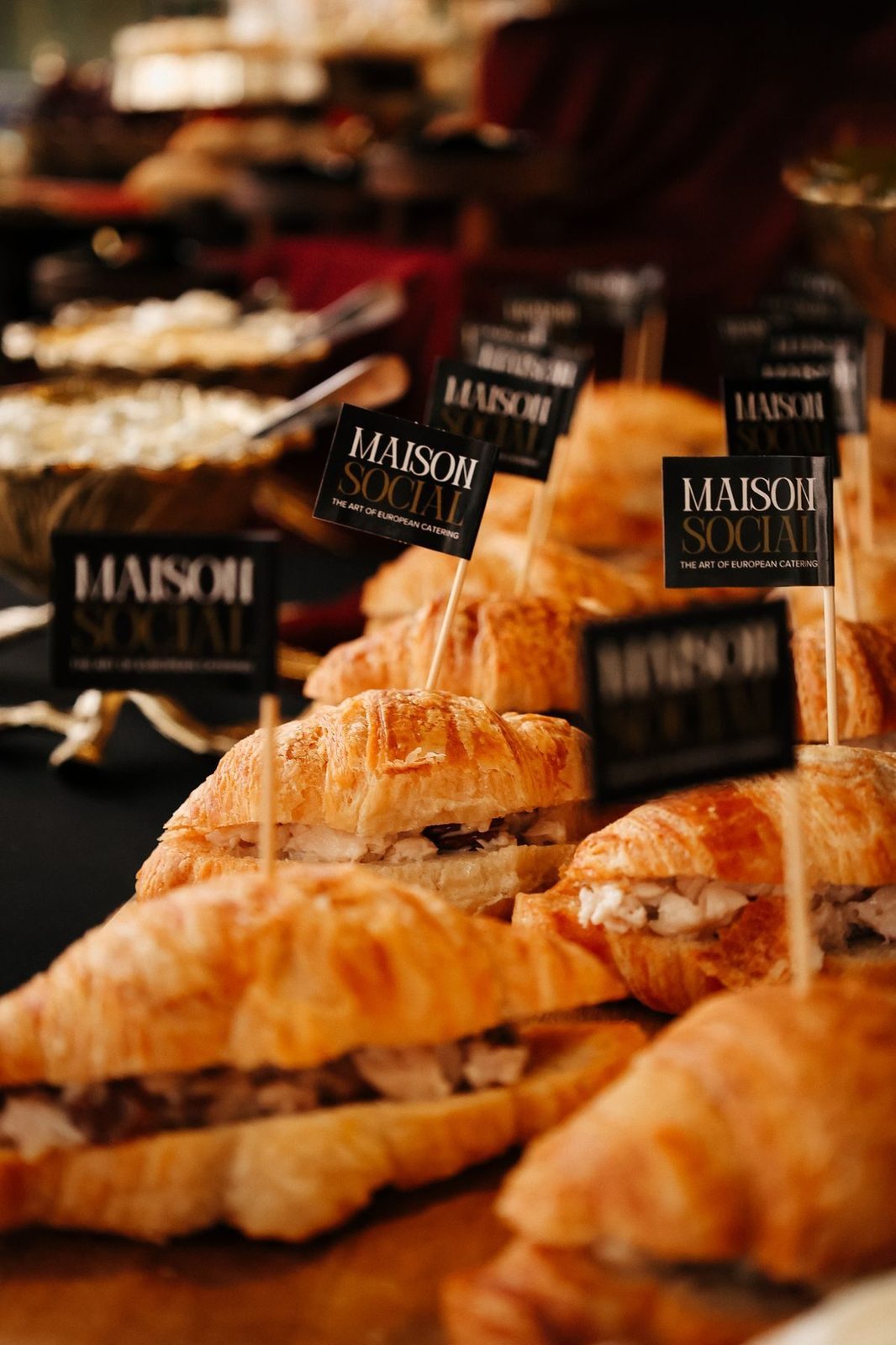 Croissant sandwiches marked with branded picks