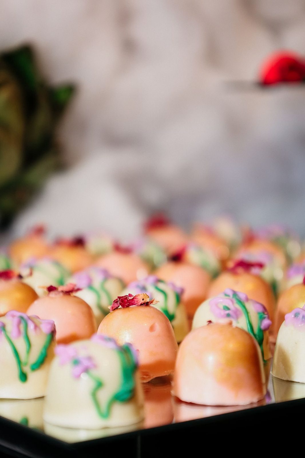 Hand painted bonbons on a dessert display