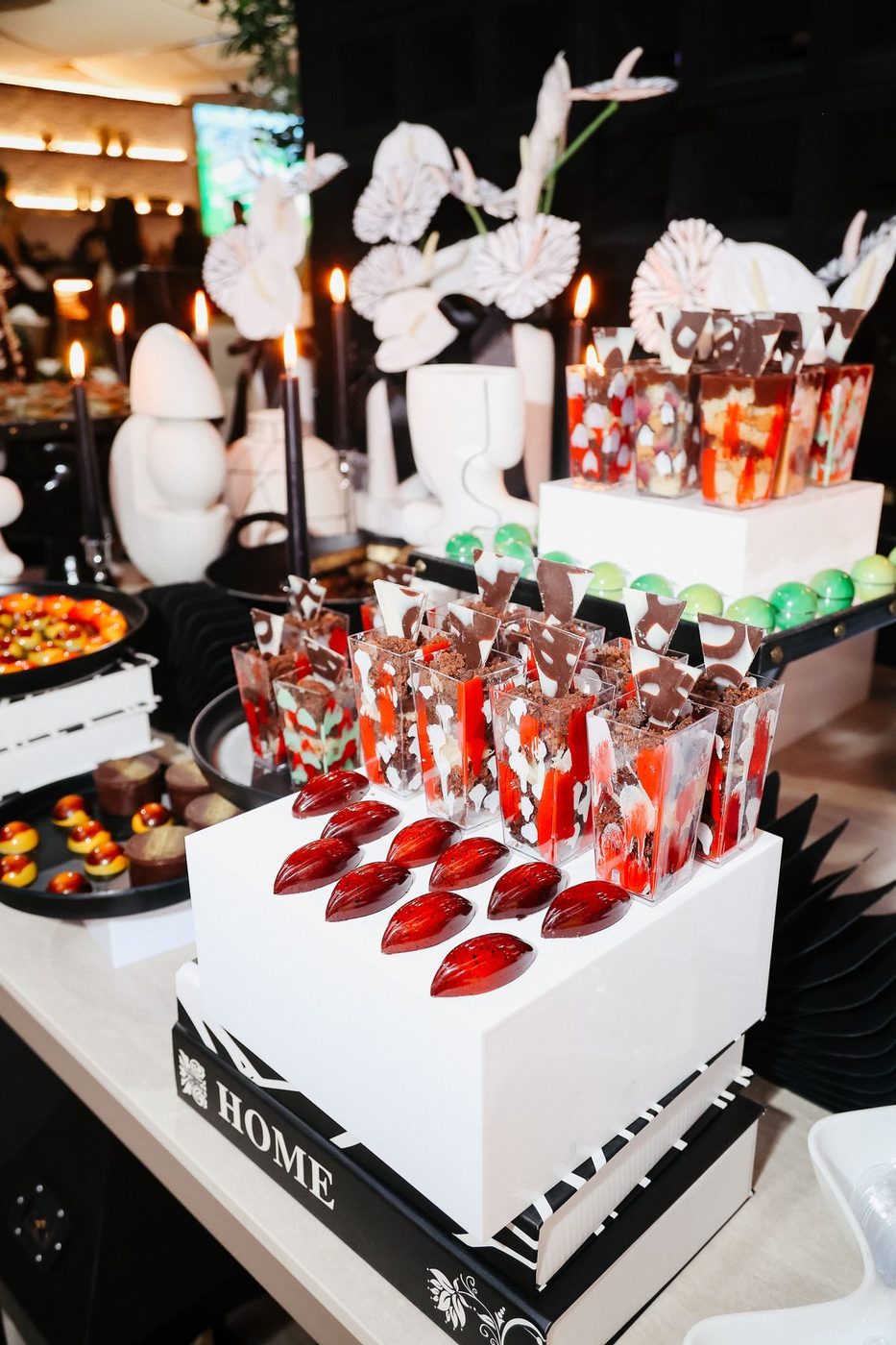 Painted dessert cups with chocolate shards and bon bons