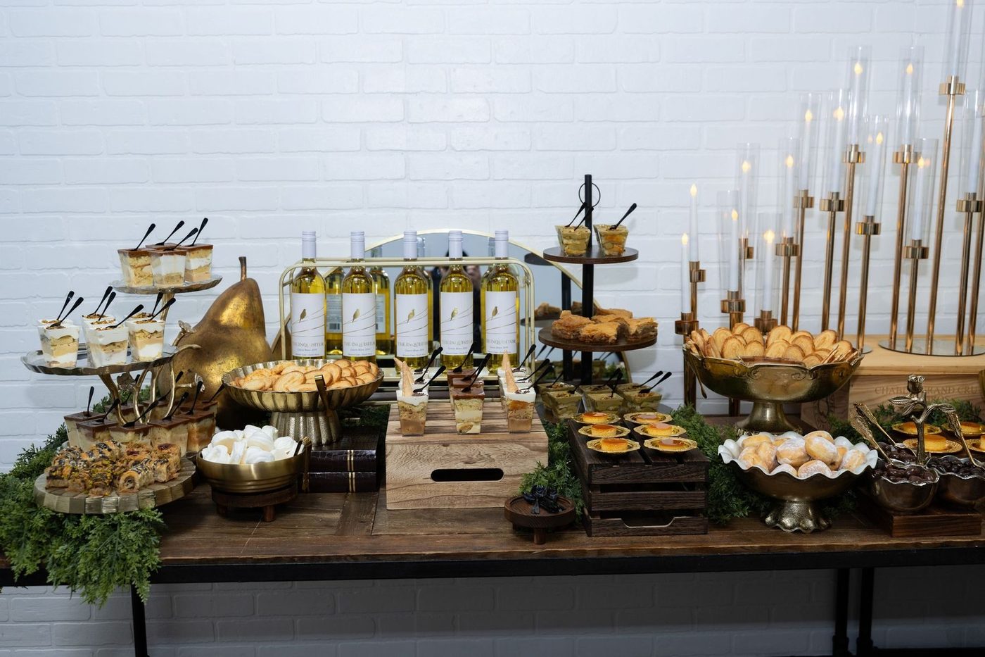 Dessert table with tiramisu cups, flan and wine